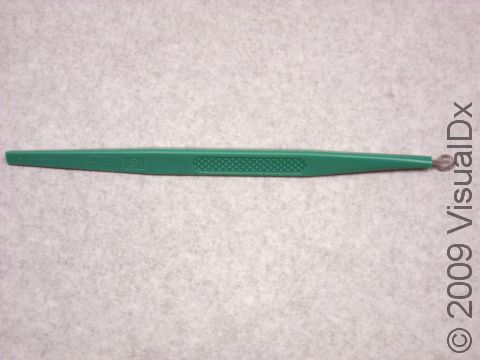 This instrument, a curette, is used to scrape away skin growths during the procedure known as curettage.